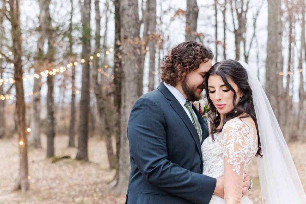 Bride and groom celebrating a winter wedding at Hidden Homestead in Smiths Grove KY, surrounded by muted green tones and natural rustic charm