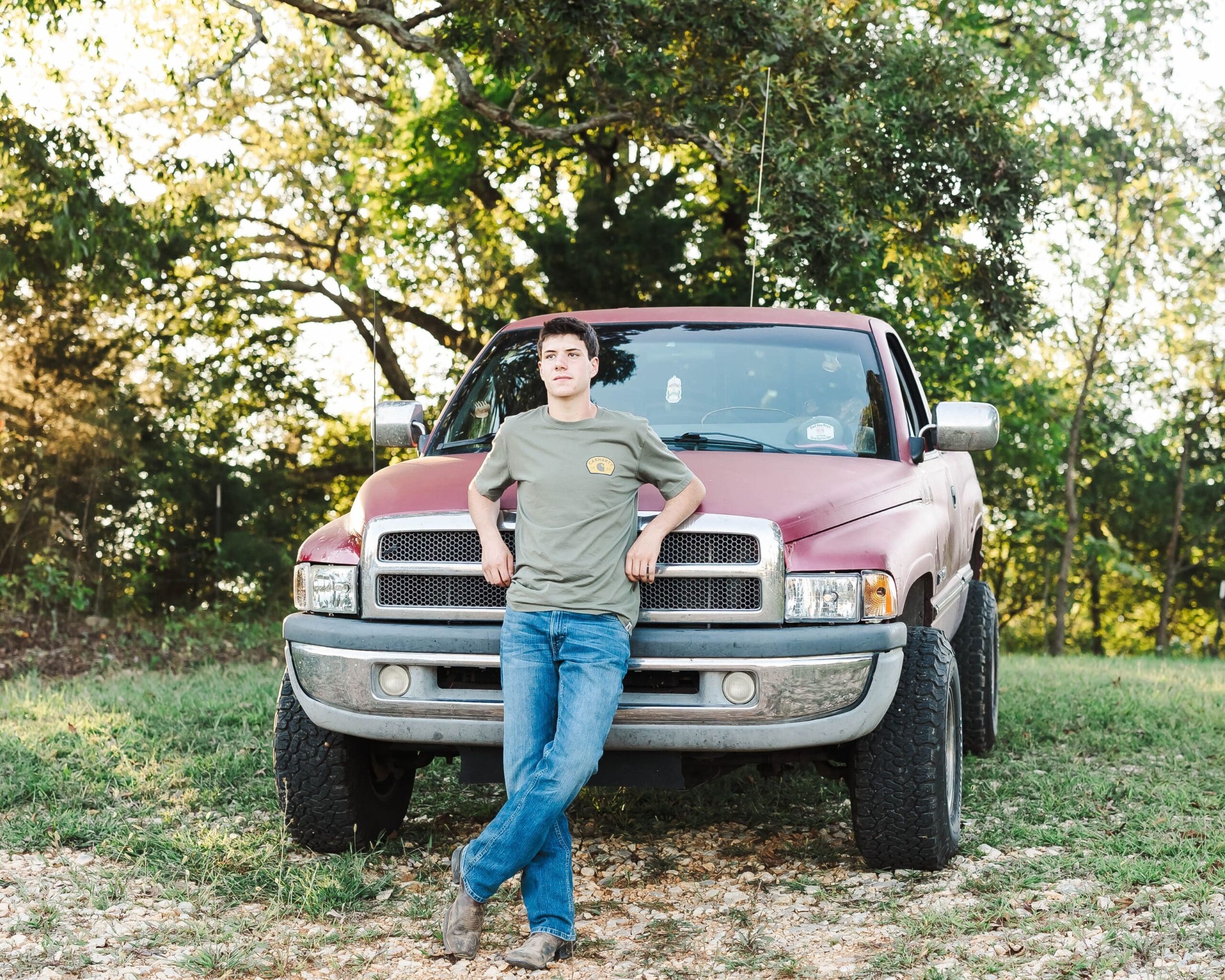 Senior guy portrait session in Bowling Green KY featuring a truck and rustic countryside setting, shot by Jordan Z Photography