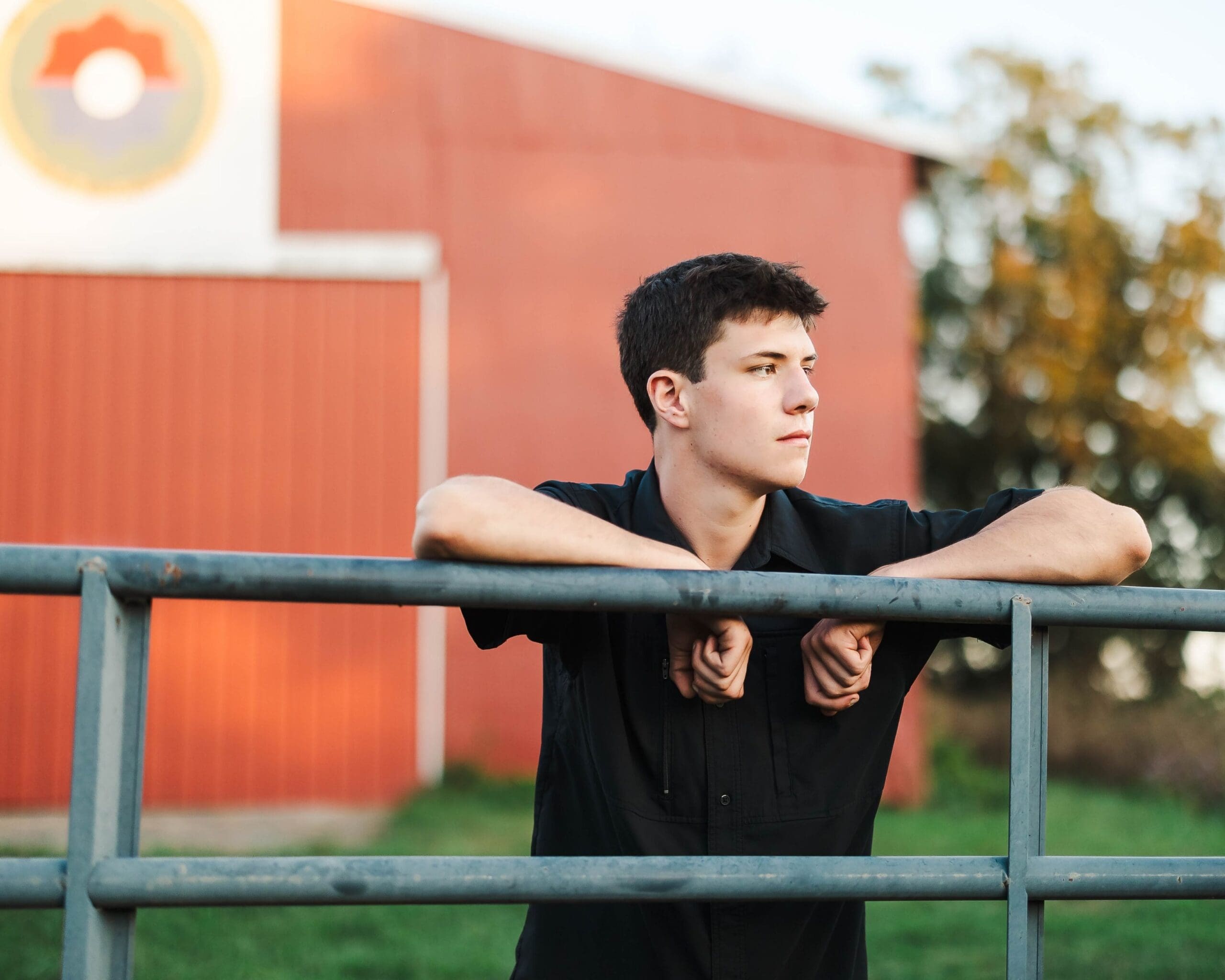Golden hour senior portraits in Bowling Green KY with a truck, dirt bike, and countryside backdrop, shot by Jordan Z Photography