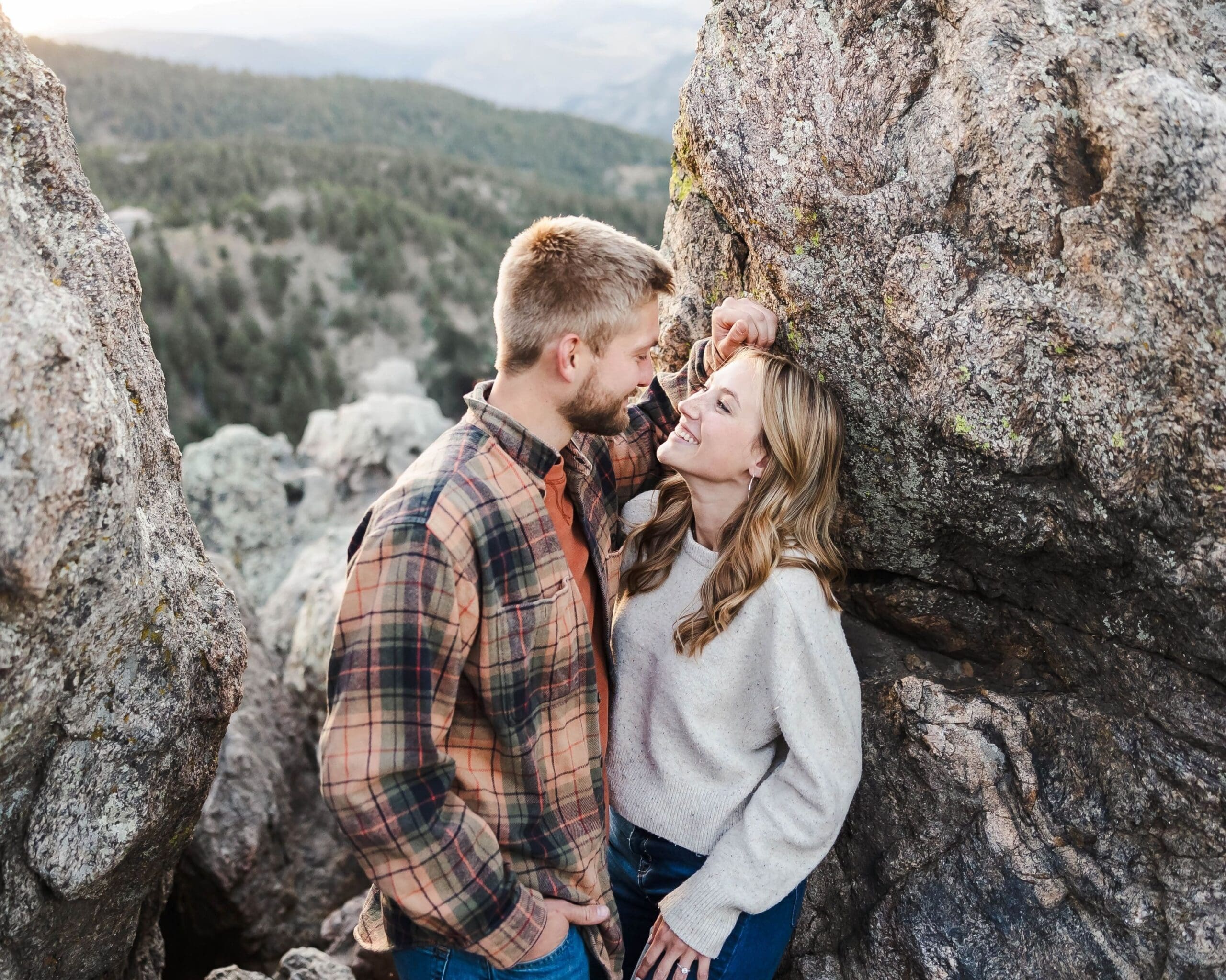 Romantic sunset engagement photo with sweeping mountain views at Lost Gulch Overlook Trailhead captured by Jordan Z Photography.