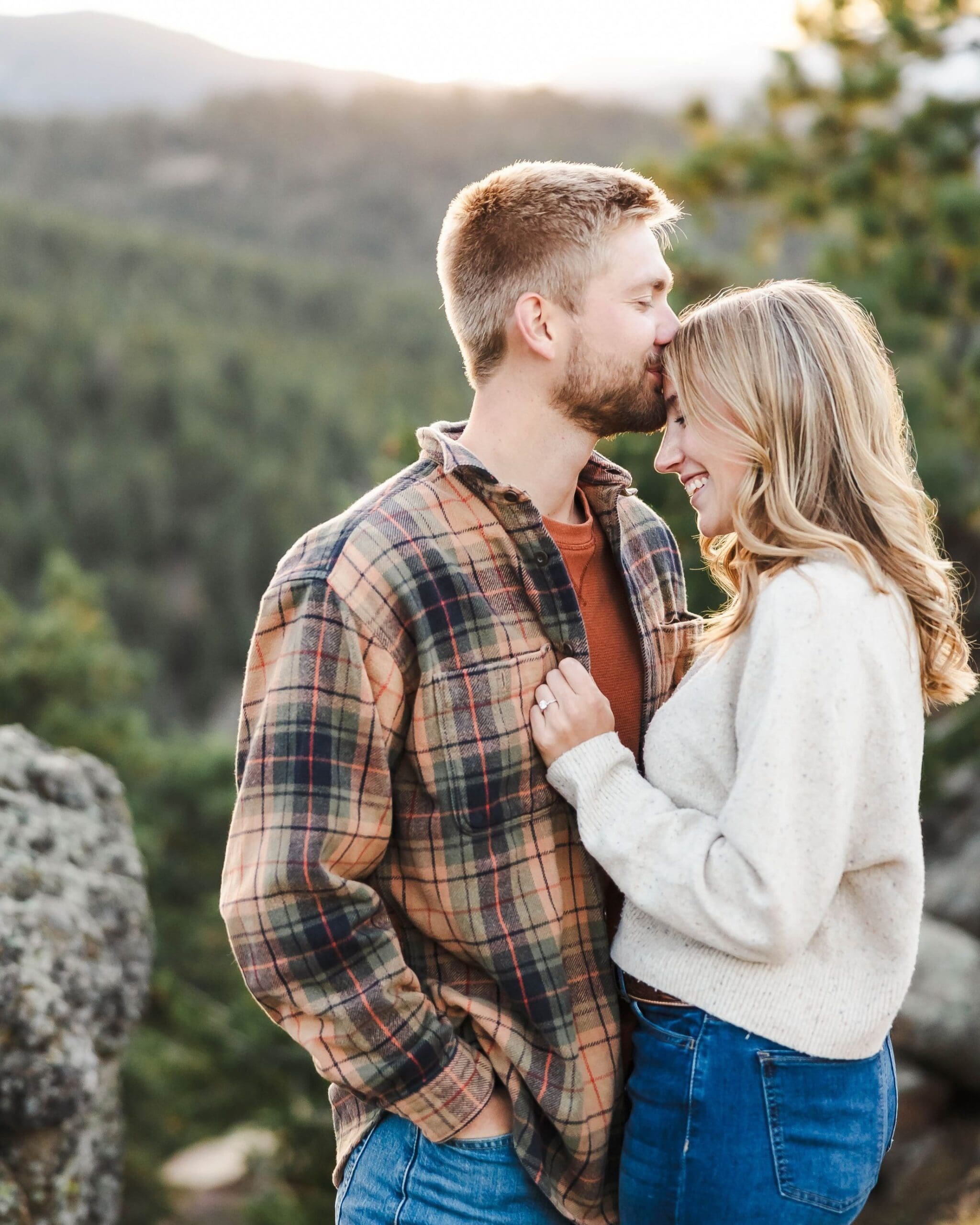Romantic moment of engaged couple at sunset taken on the top of Lost Gulch Trailhead in Boulder, Colorado, taken by Jordan Z Photography. 