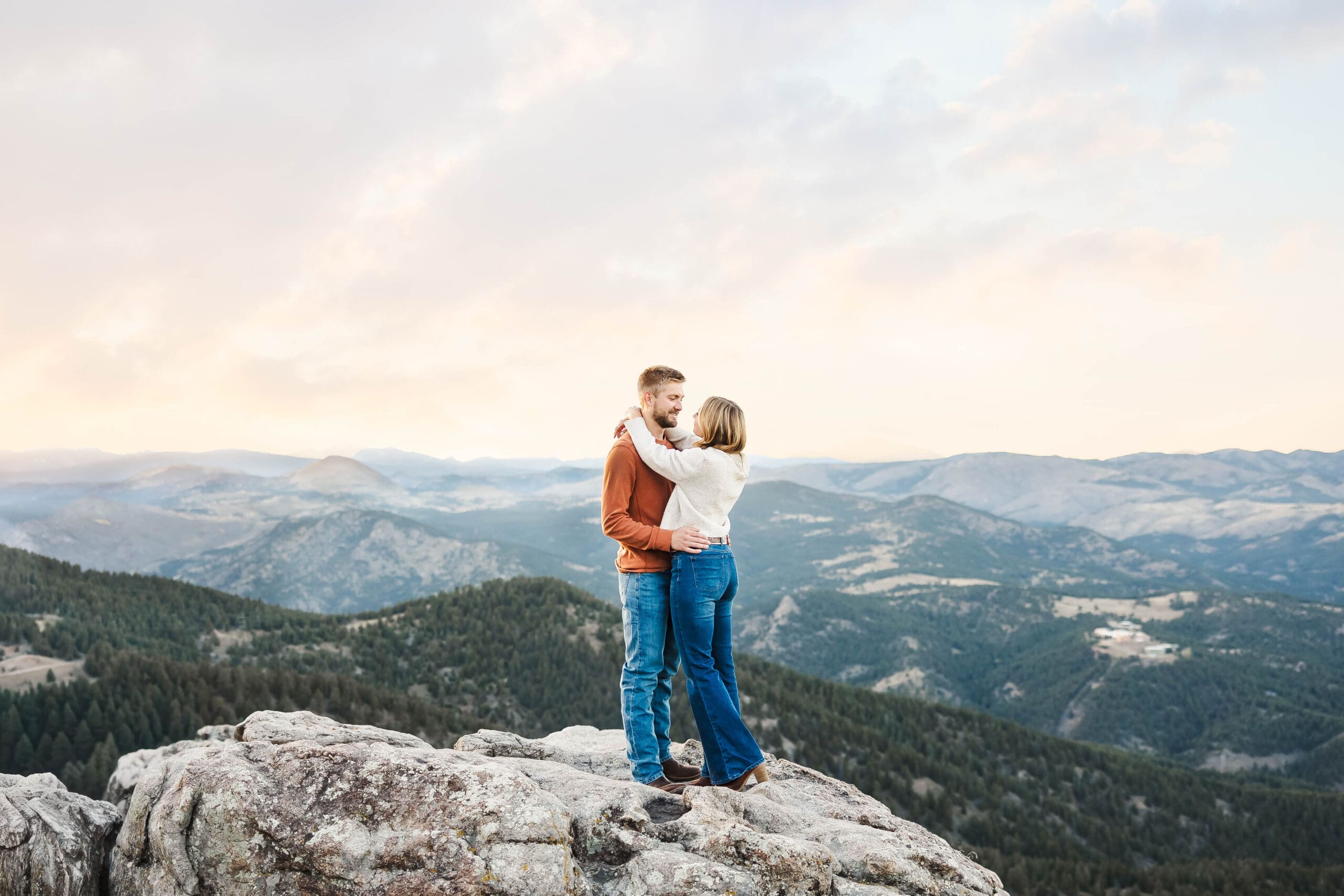 unset engagement portrait overlooking the Colorado mountains at Lost Gulch Overlook Trailhead photographed by Jordan Z Photography
