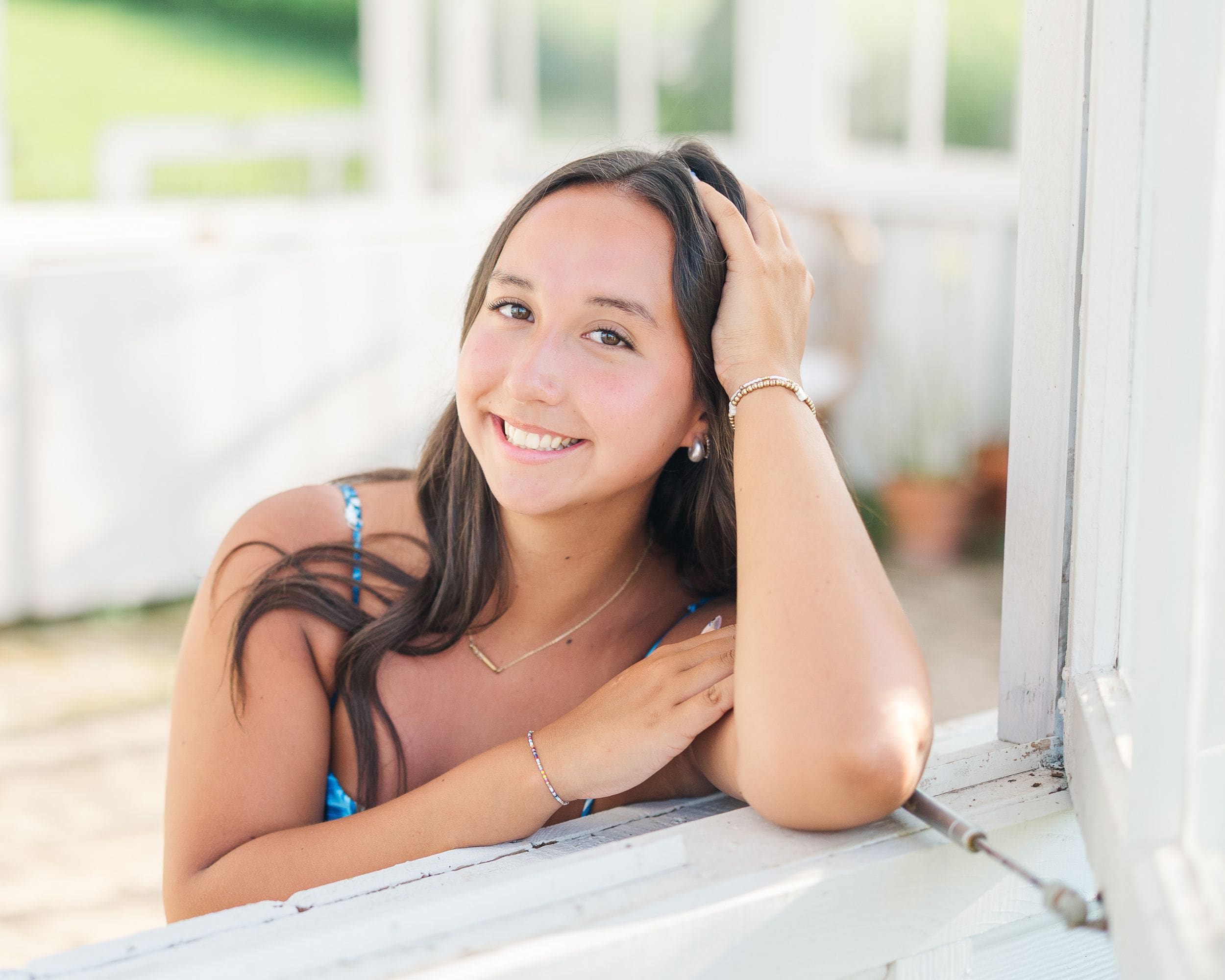 High school senior taking her senior portraits session at Steenbergen Flower Farm in southern Kentucky, shot by Jordan Z Photography.
