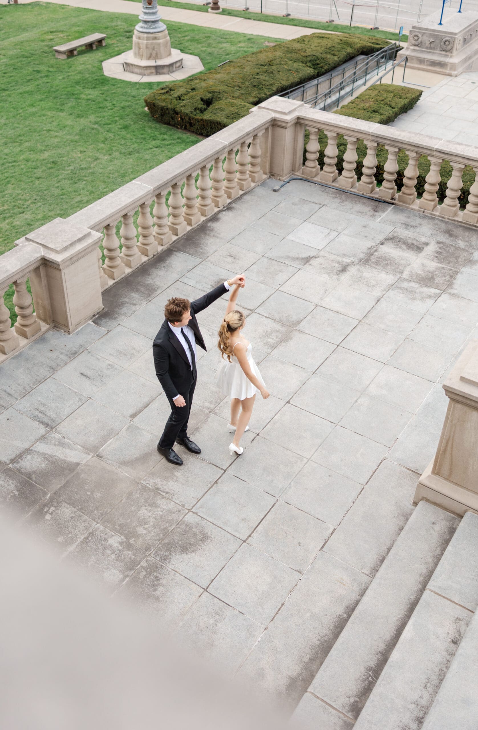 Couple embracing on the steps of the Indiana War Memorial in downtown Indianapolis, shot by Jordan Z Photography