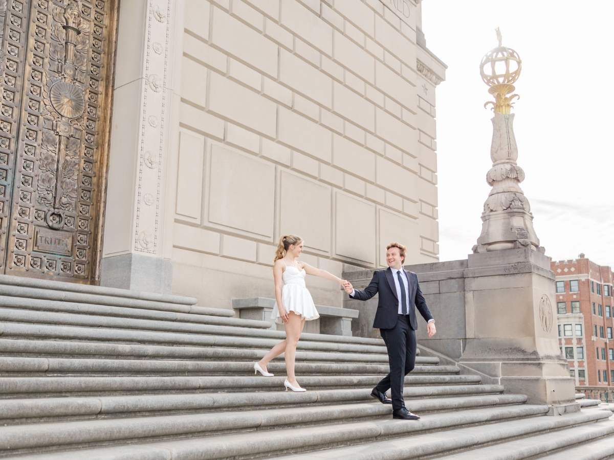 Engaged couple embracing on the steps of the Indiana War Memorial in downtown Indianapolis, shot by Jordan Z Photography